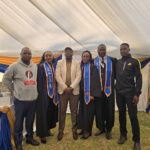 FIVE GRADUANDS AT THE ADVANCED SPORTS MANAGEMENT COURSE GRADUATION CEREMONY.